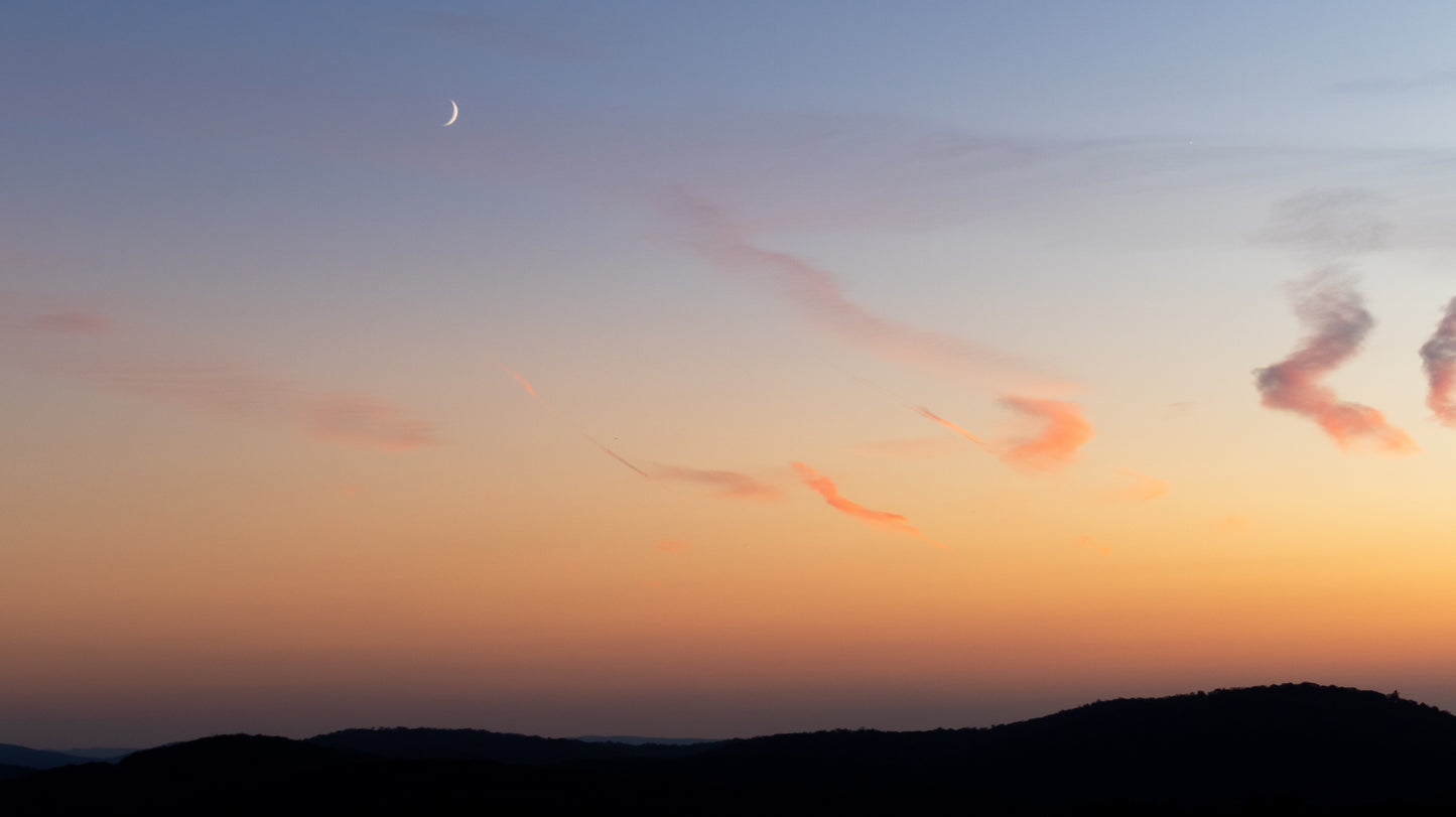 Moonlit Sunset Over Hills