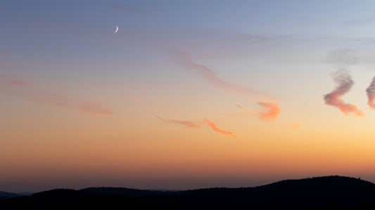 Moonlit Sunset Over Hills